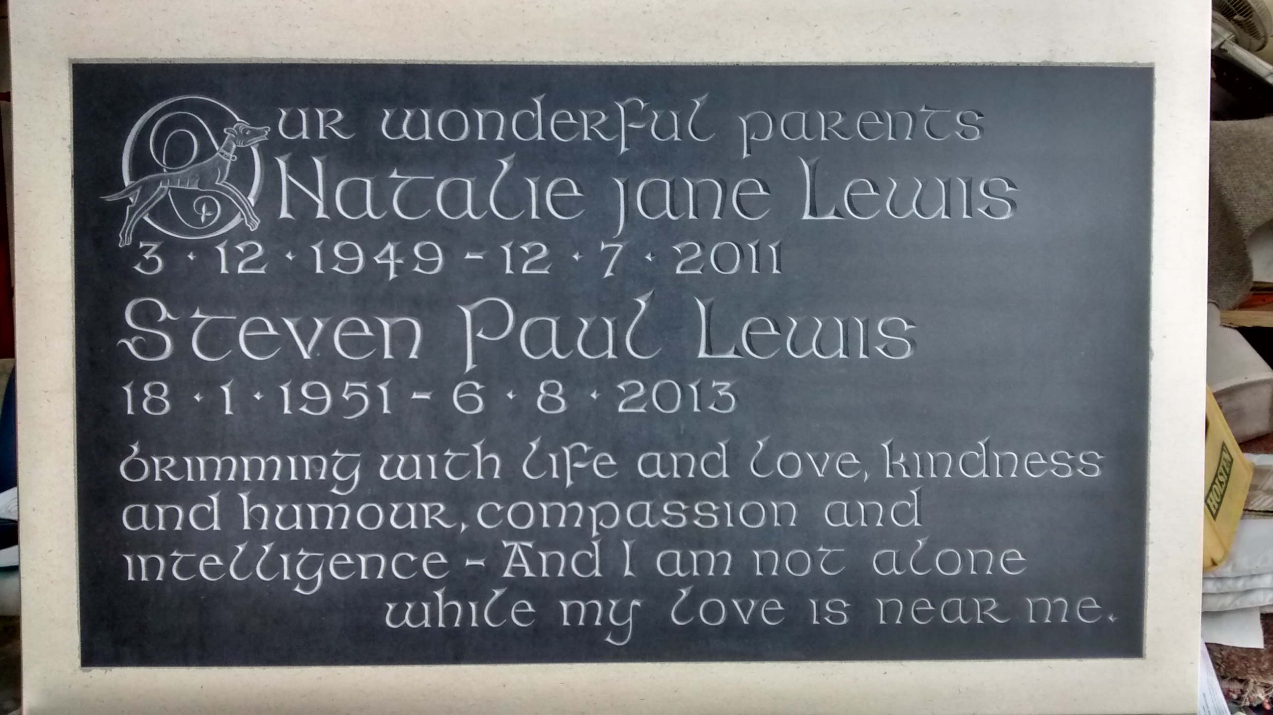 Welsh slate plaque set in to the face of a Portland stone tablet