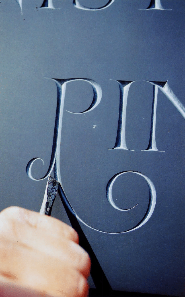 Chiseling a Letter P in slate