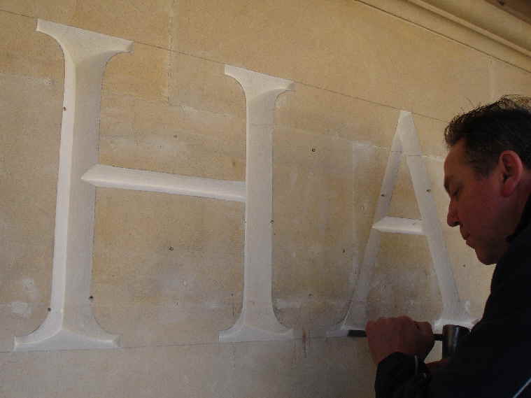 Hand carving the 18inch high temple like letters